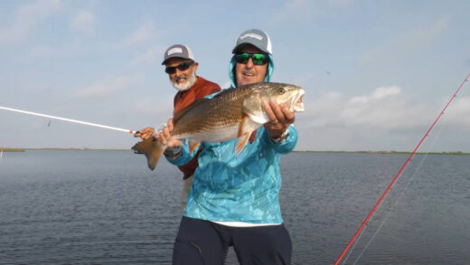 Captain Sergio holding a Redfish he caught