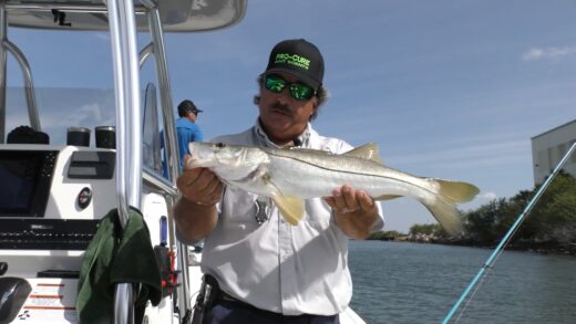 Captain George holds a Snook he'a caught