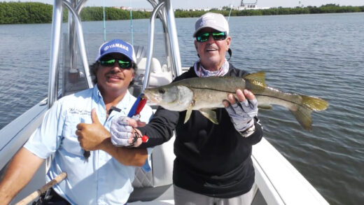 Two captains with a Snook
